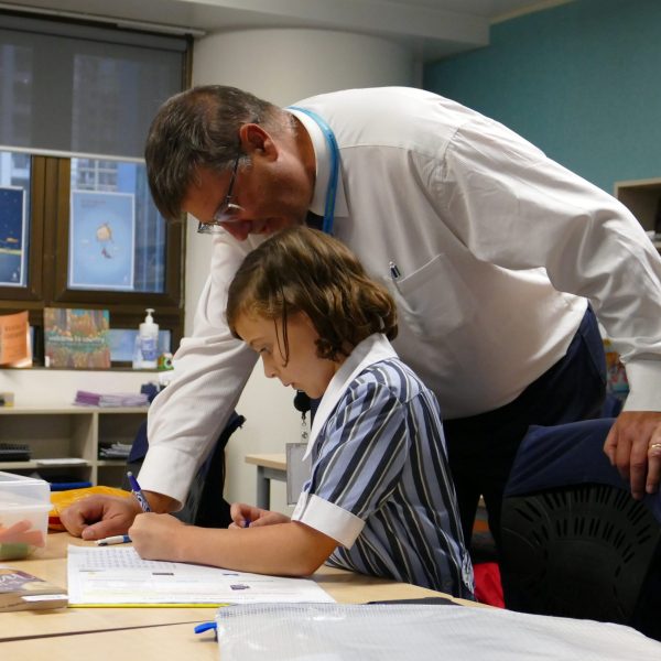 Smythe teaching in his childhood classroom